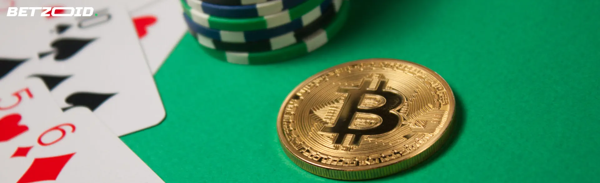 Cryptocurrency coin next to chips and cards.