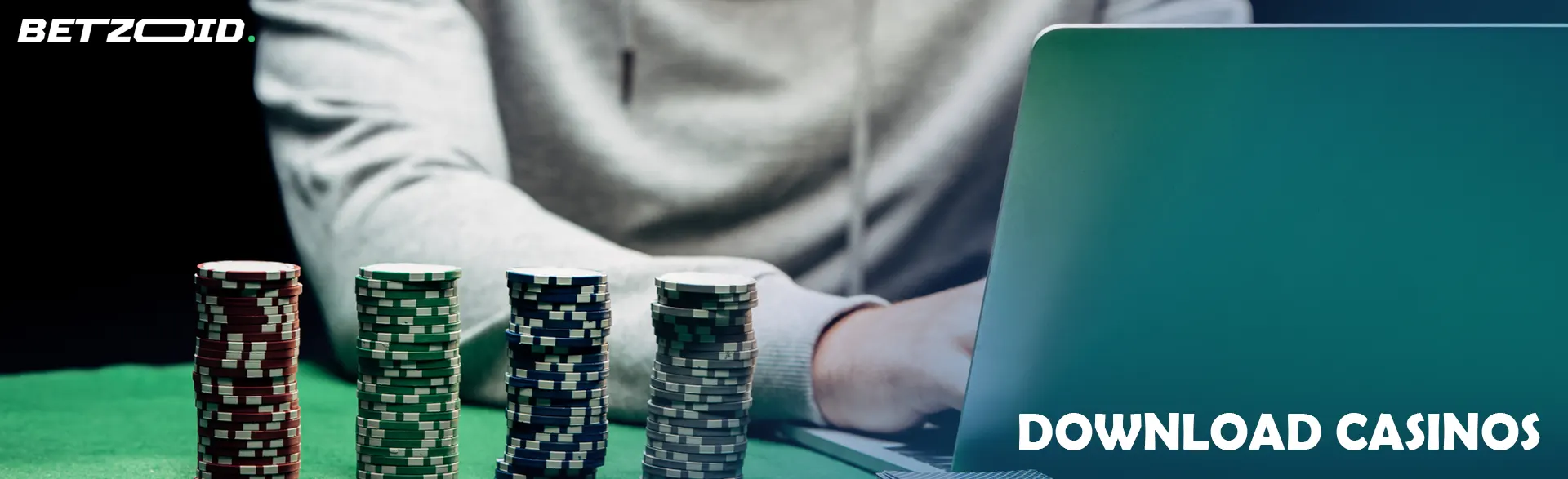 The player behind the laptop next to the casino chips.