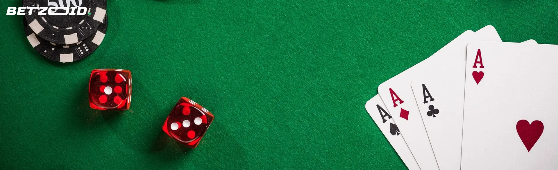 Cards, casino chips and dice on a green background.