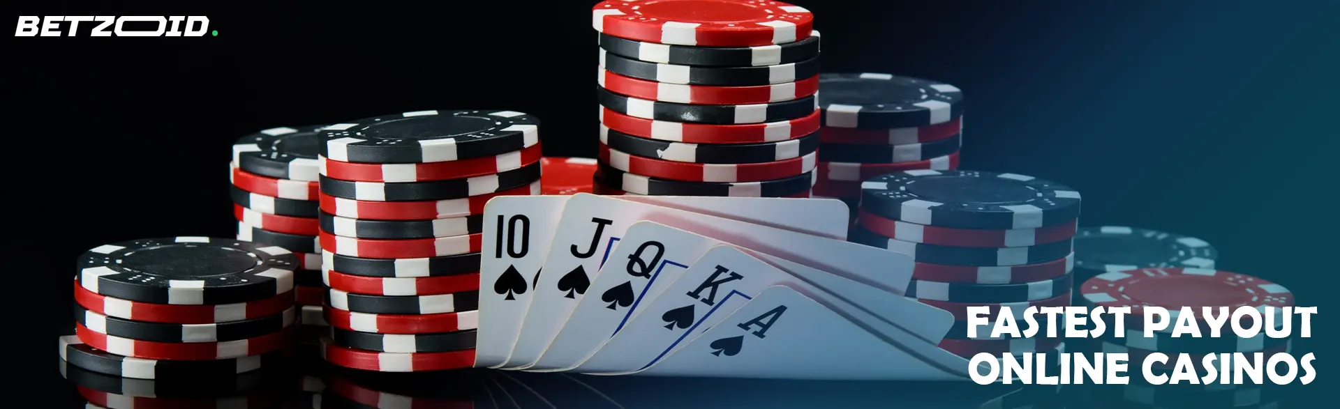 A pile of chips and cards on a dark background.
