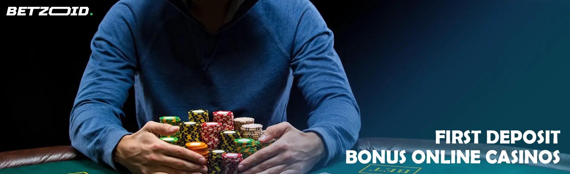 A player is holding a pile of chips on a casino table.