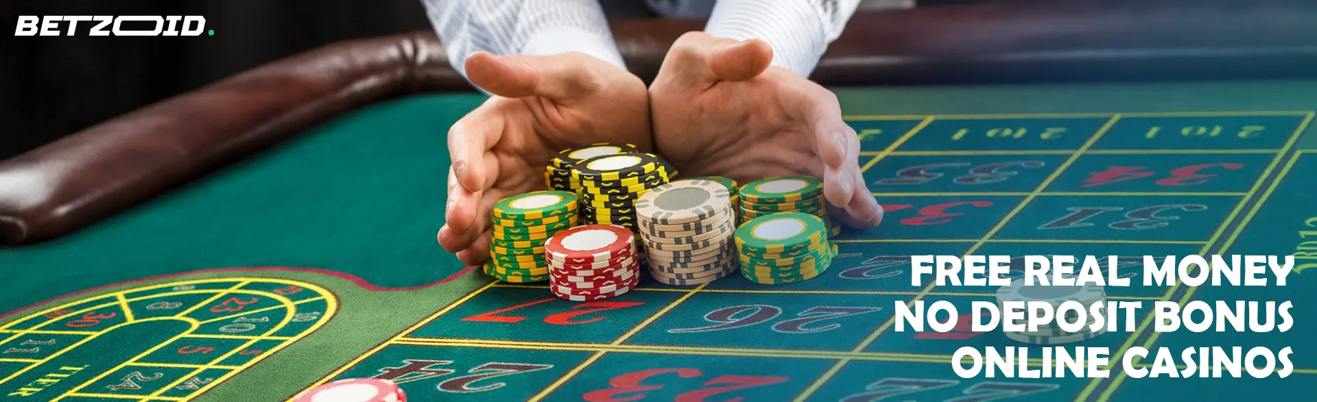 A player is holding a pile of chips on a casino table.