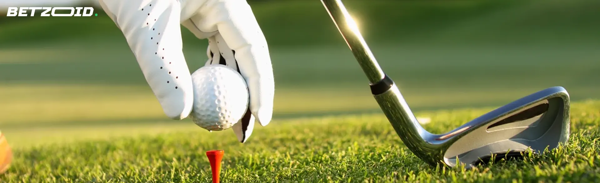 A golfer puts the ball up for a shot.