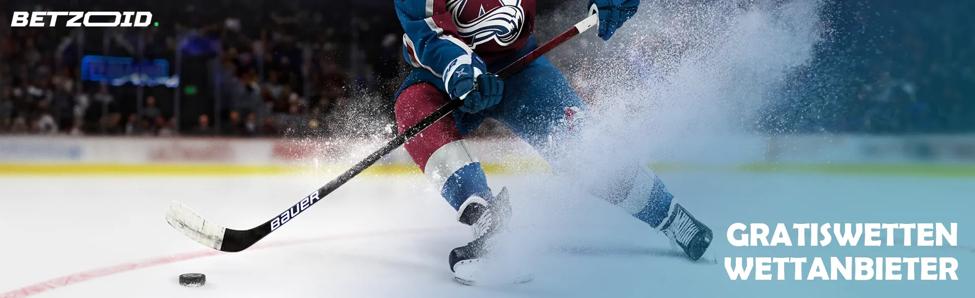 Ein Hockeyspieler versucht, den Puck abzulenken.