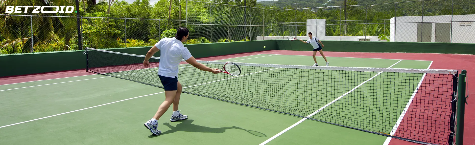 Tennis players in action during a game.