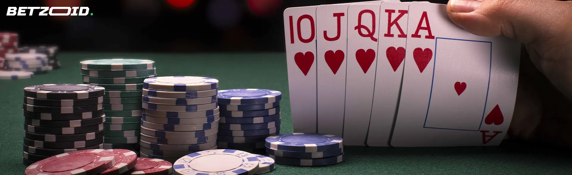 Casino chips next to a combination of cards.