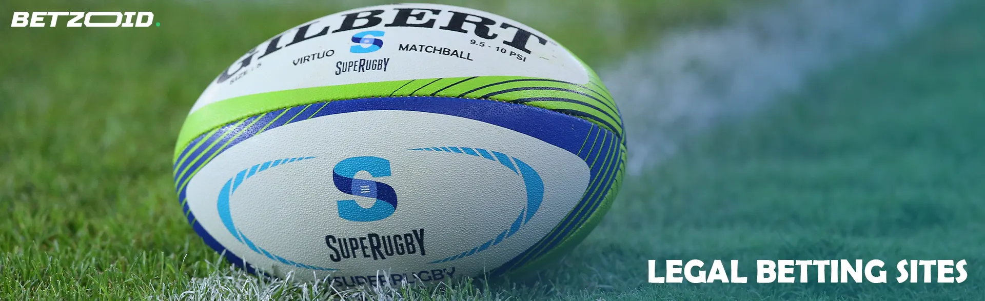 A rugby ball lies on the grass.