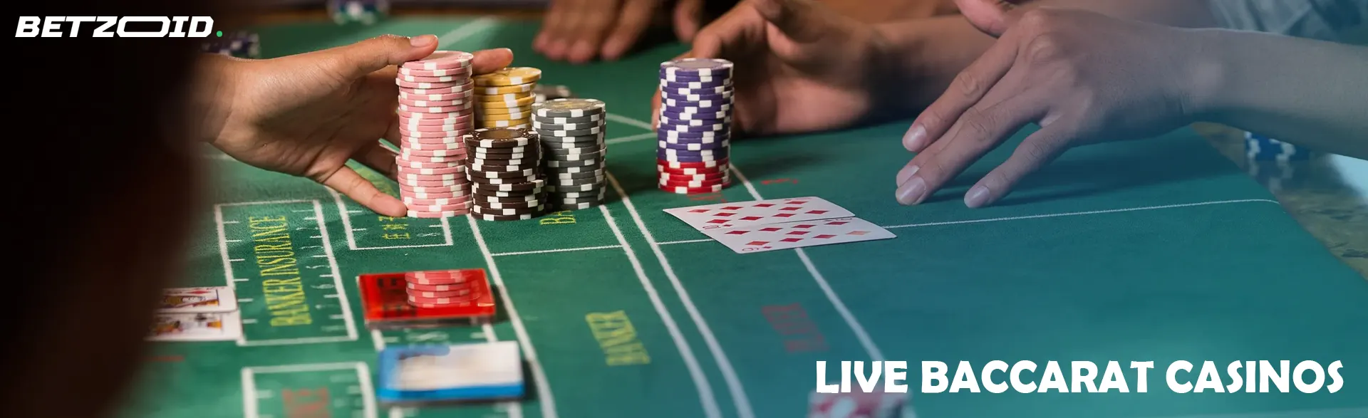 Players place bets with chips on the baccarat table.