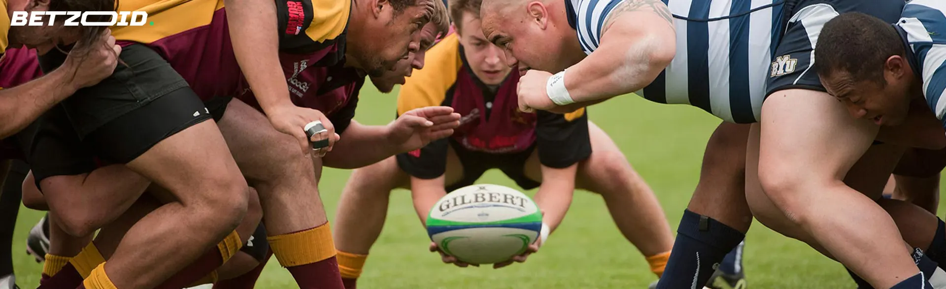 Rugby players with the ball during the game.