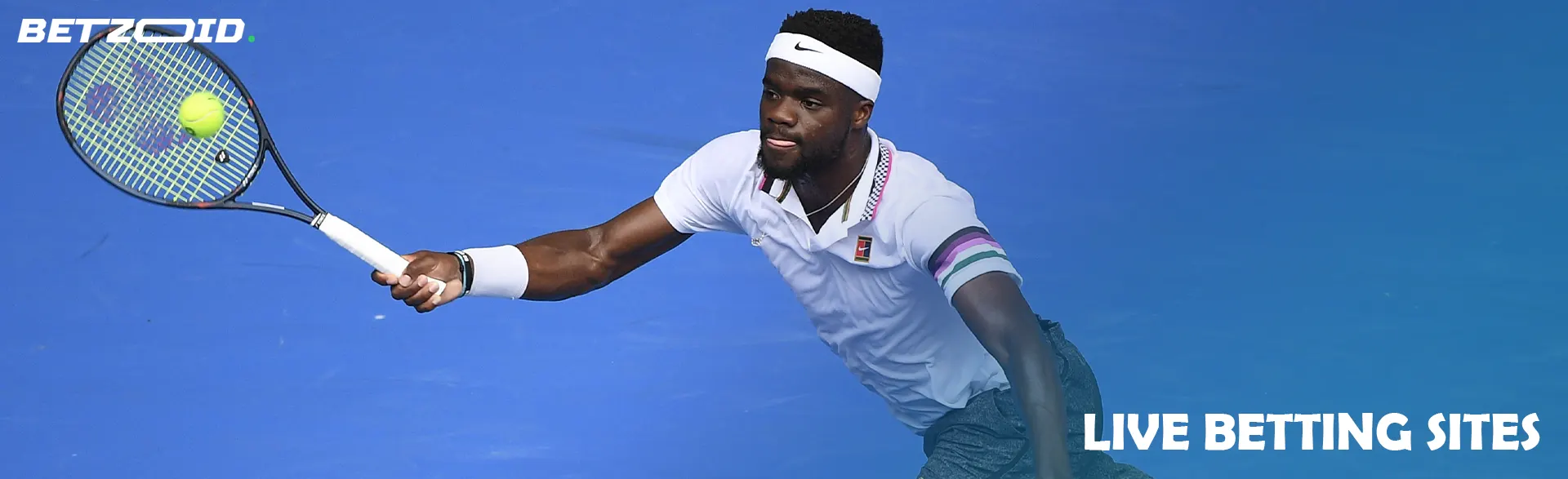 A tennis player tries to hit the ball.