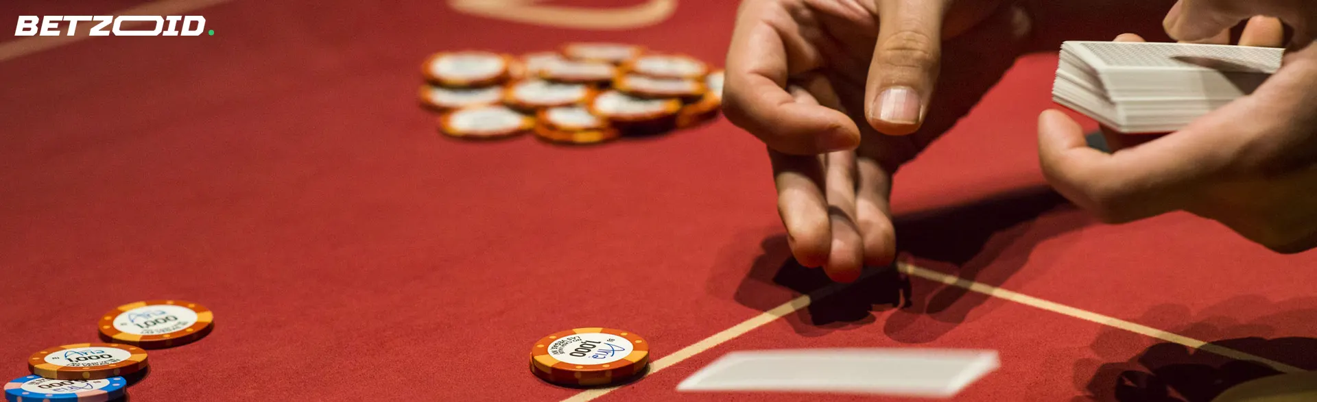 The player lays the cards on the casino table.