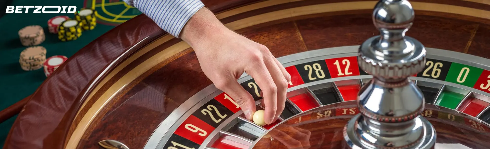 The player puts the ball on the roulette wheel.