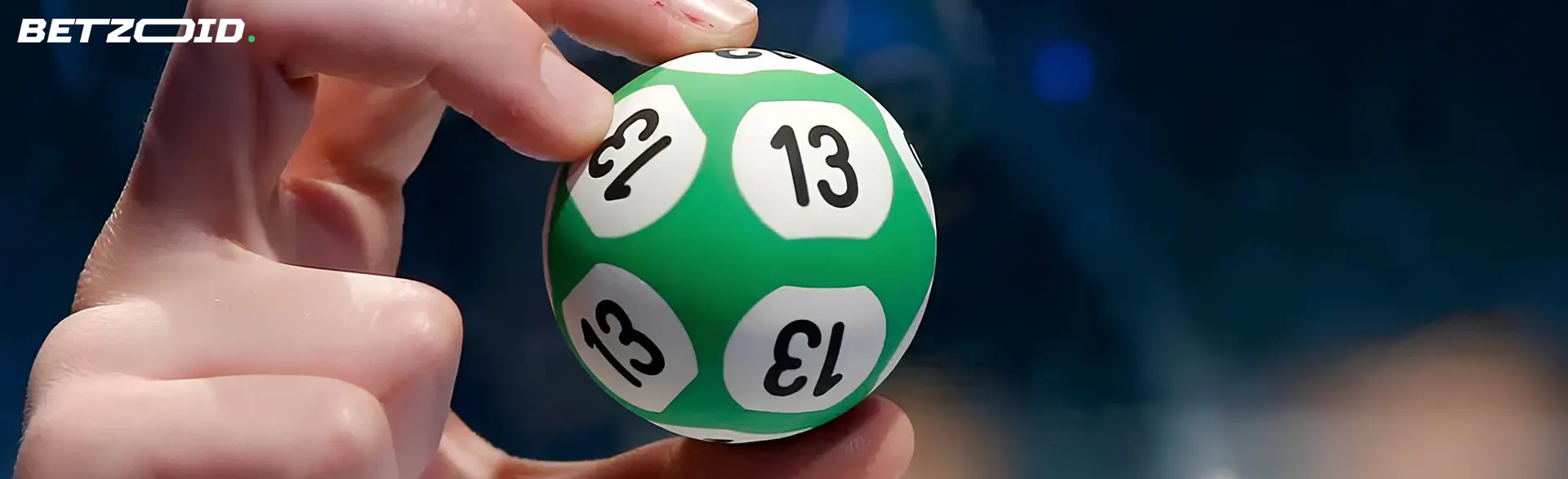 Lottery ball in human hands.