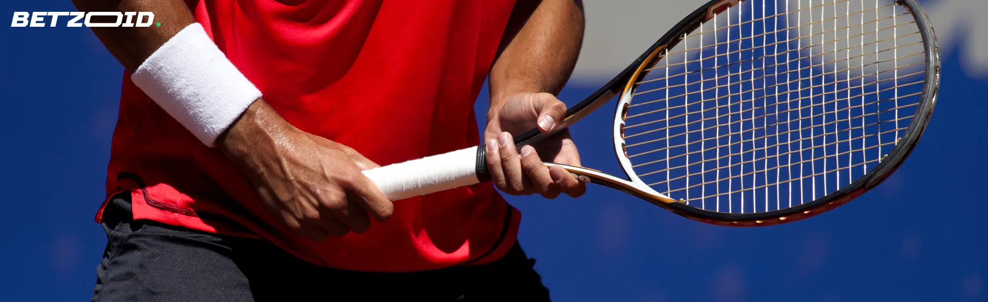 Tenista s raketou v rukou.