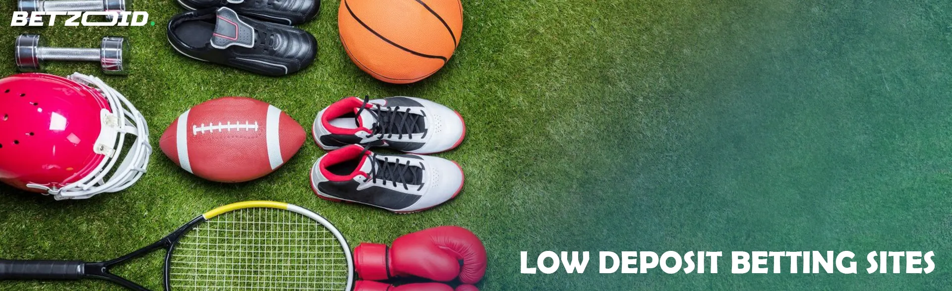 Sports equipment lies on the grass.