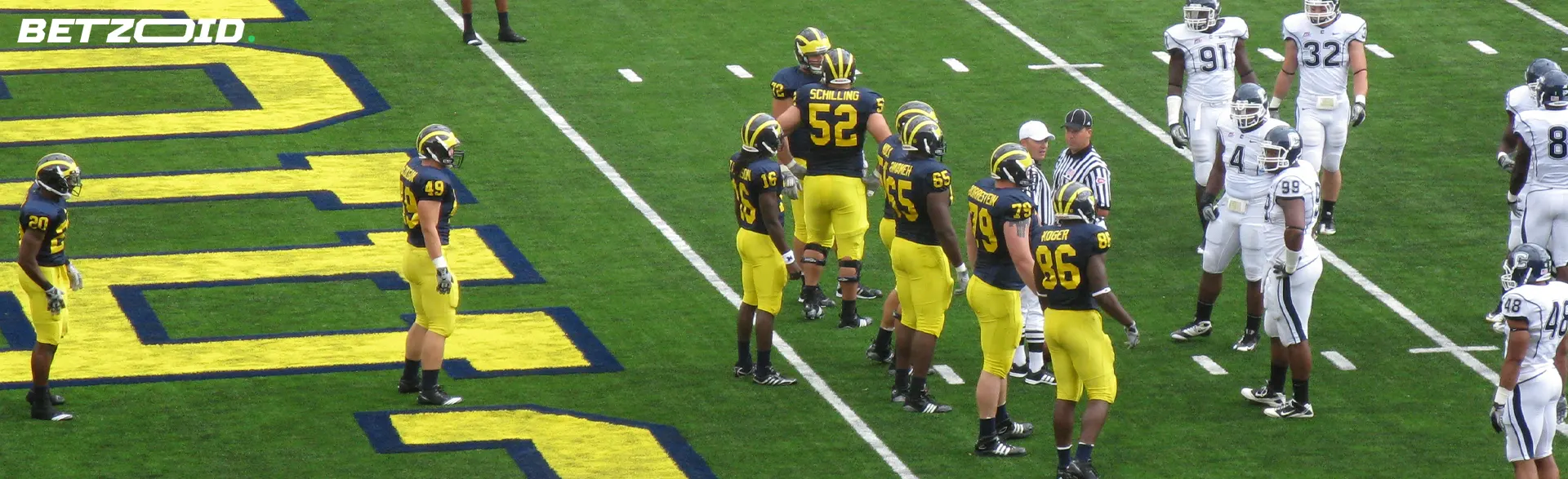 American football players on the field during the match.