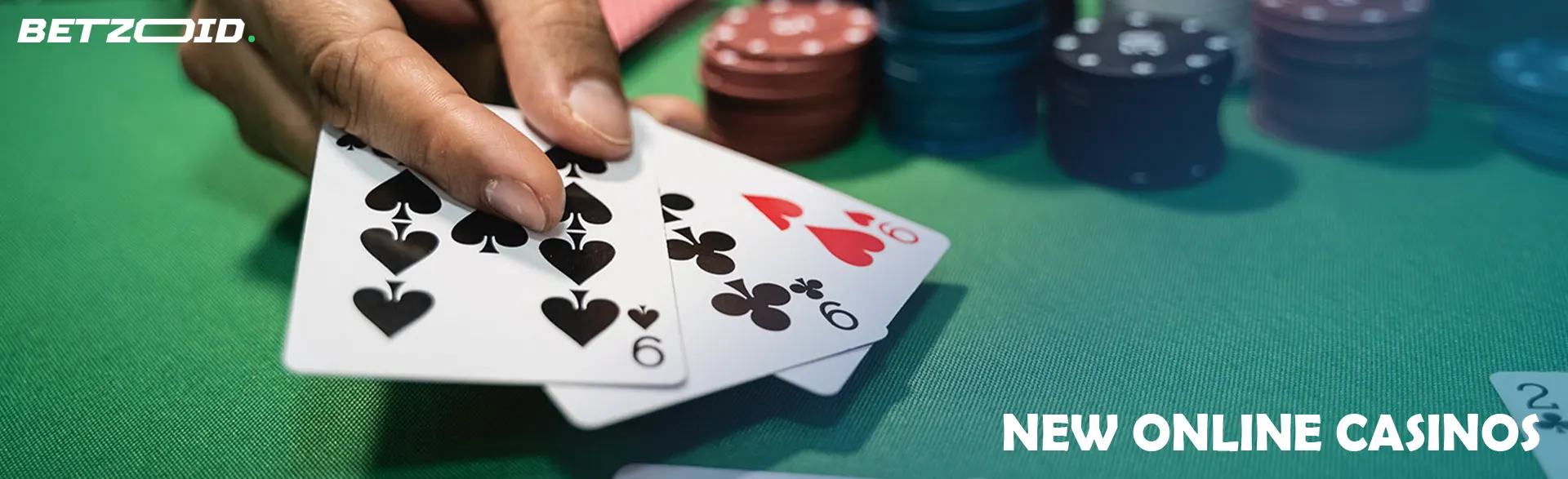 The player holds the cards on the green table.