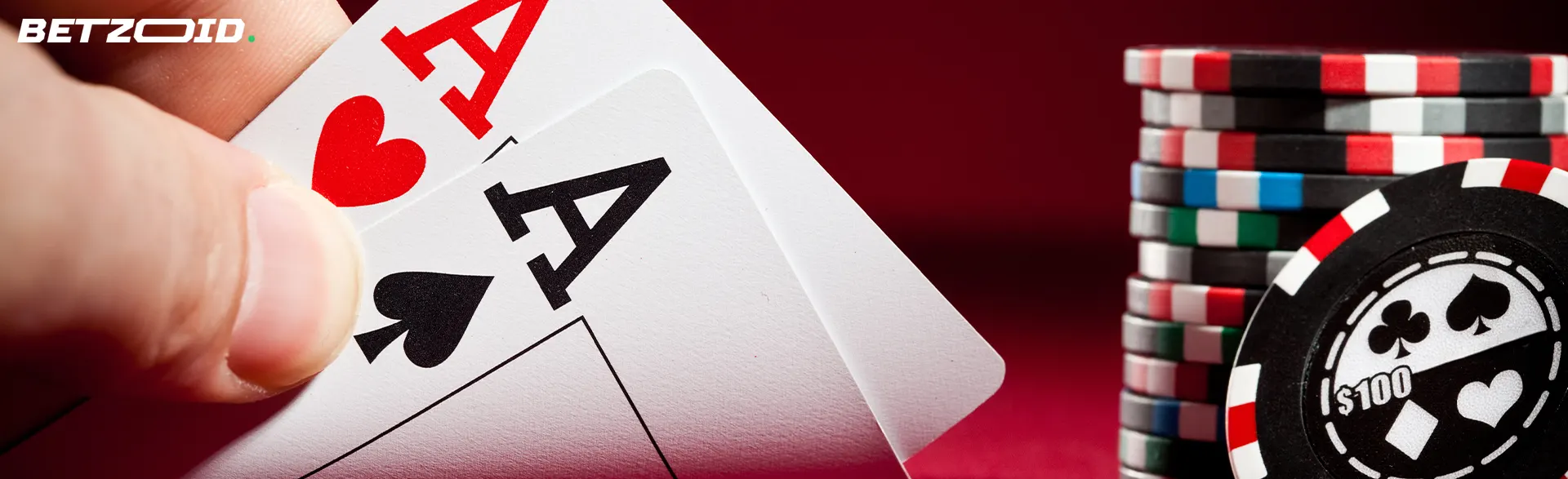 Two aces cards next to casino chips.