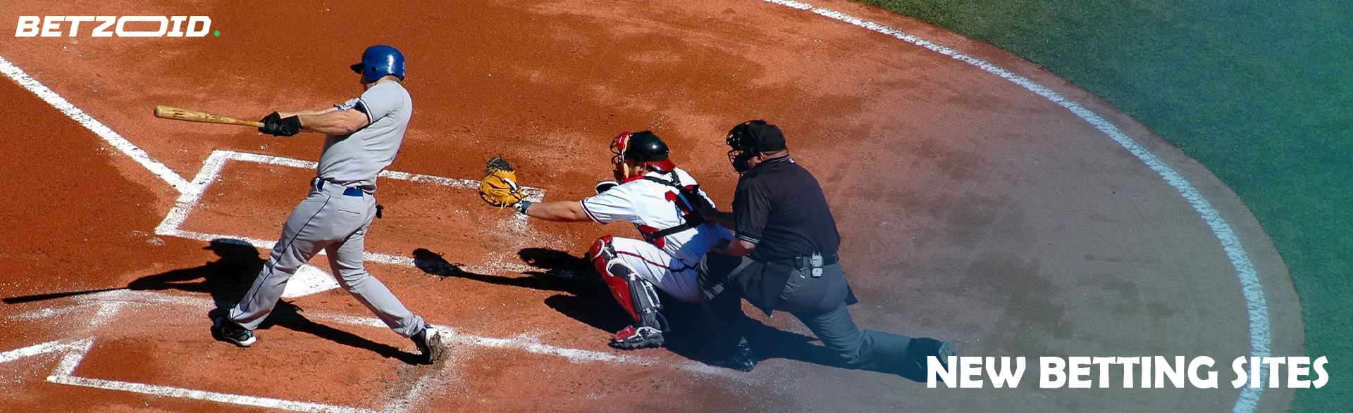 A baseball player hits the ball.