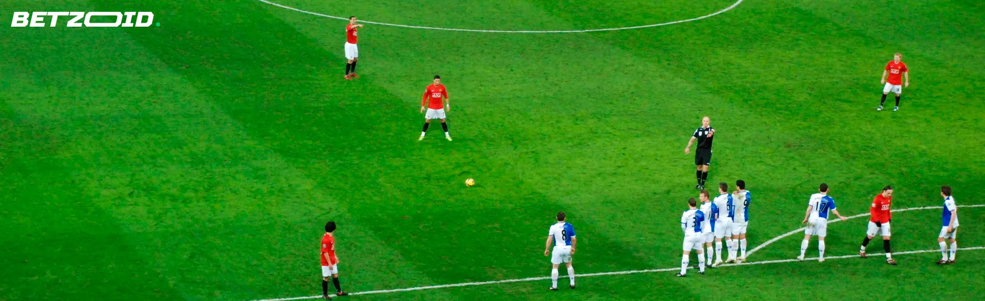 Soccer teams lined up for free kick.
