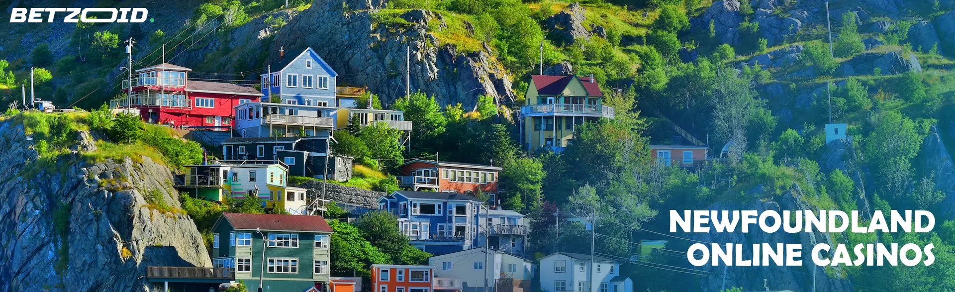 Colorful houses on a hillside in Newfoundland, representing the scenic backdrop for Newfoundland online casinos.