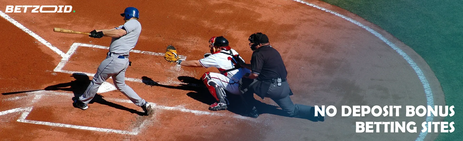 A baseball player swings the bat during a game.