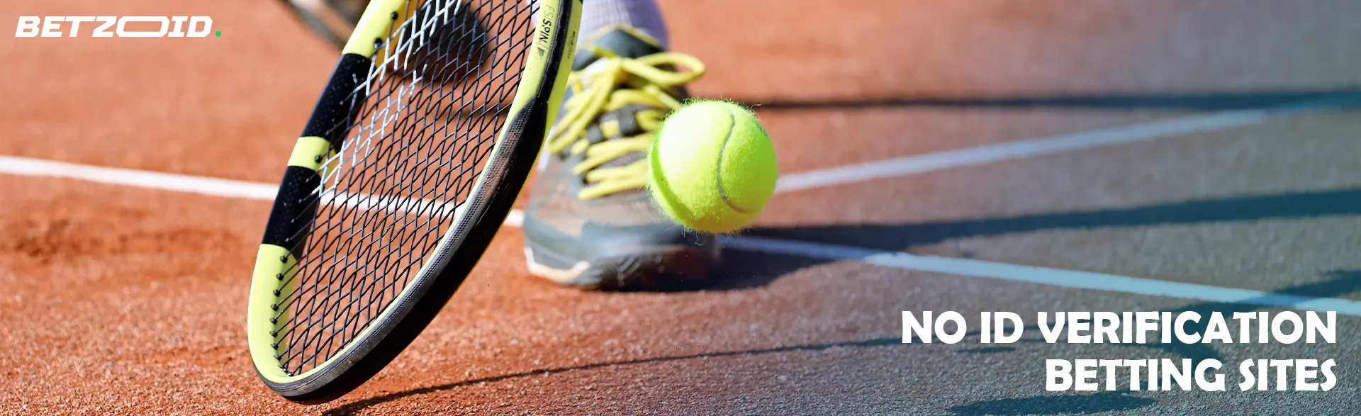 A tennis player tries to catch the ball with his racket.