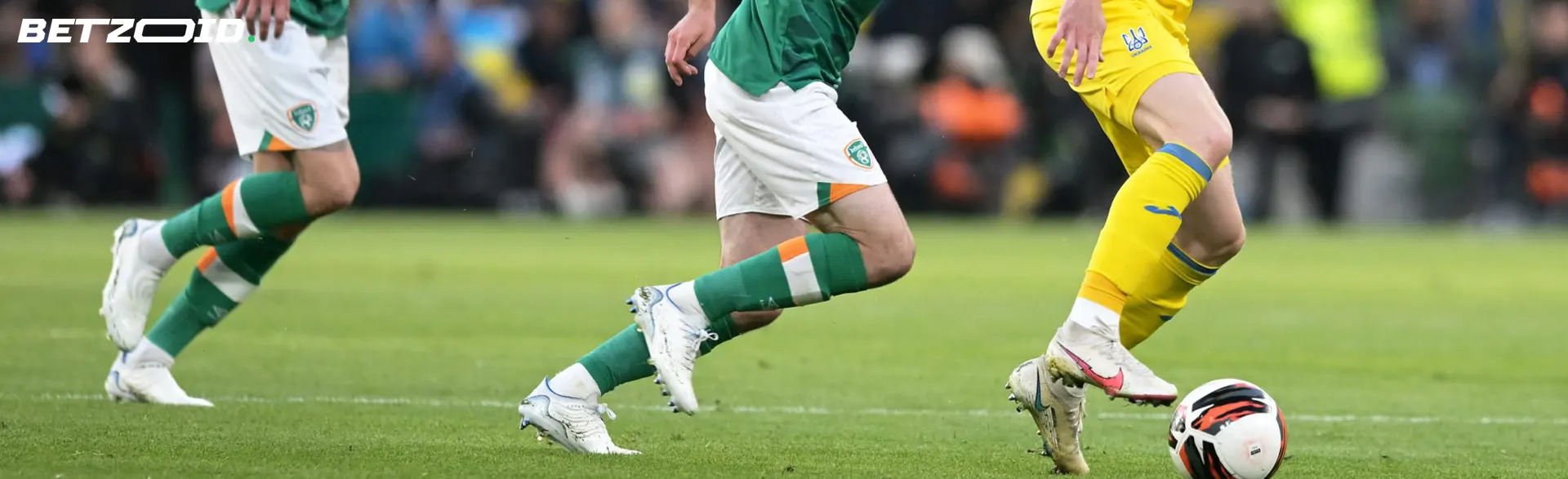 Football players fight for the ball during a game.