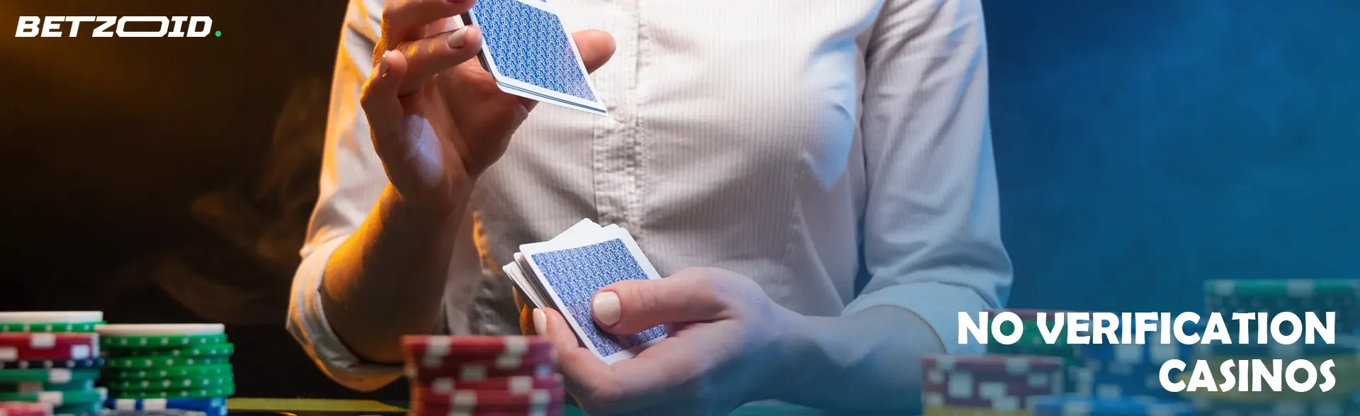 The player shuffles the cards next to the casino chips.