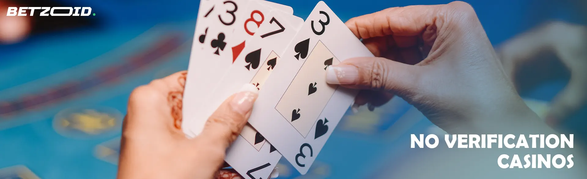 The player is holding cards on the background of the casino table.
