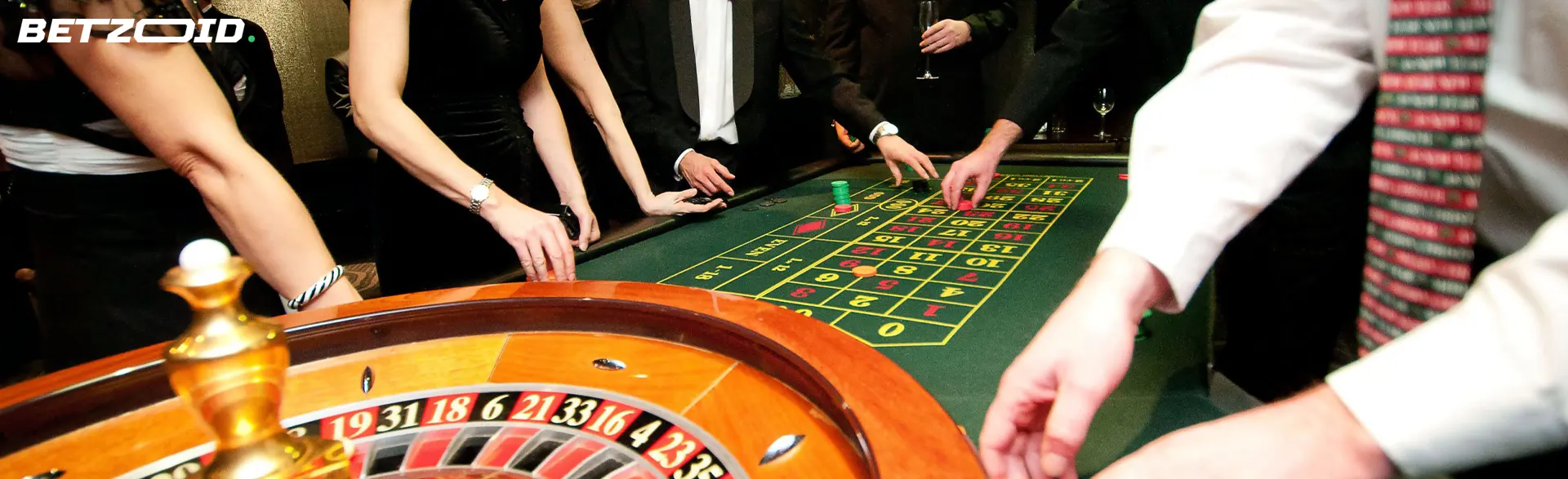 Players around the roulette wheel.