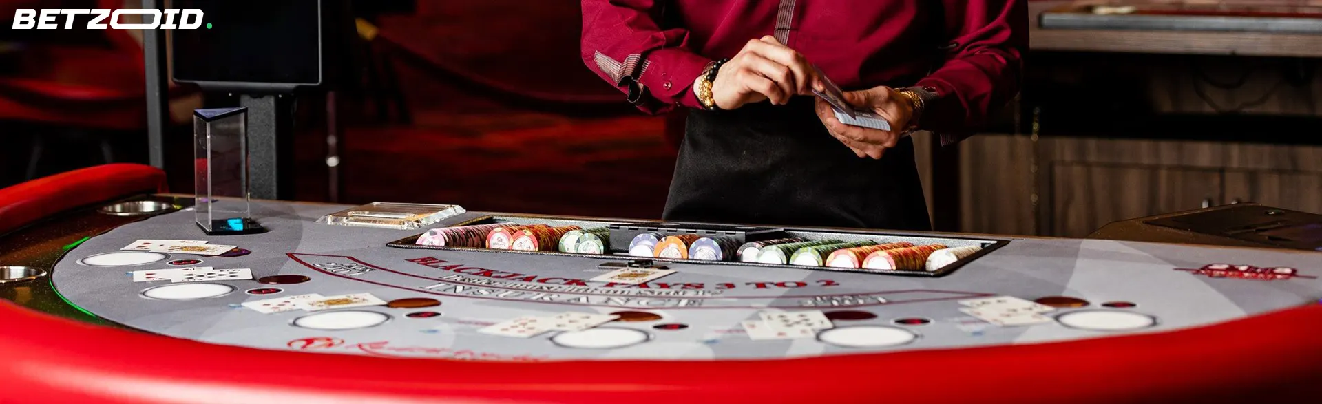 Dealer shuffling cards at a blackjack table, illustrating the professional gaming environment in Nunavut casinos.