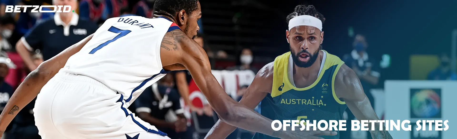 Two basketball players compete for the ball.