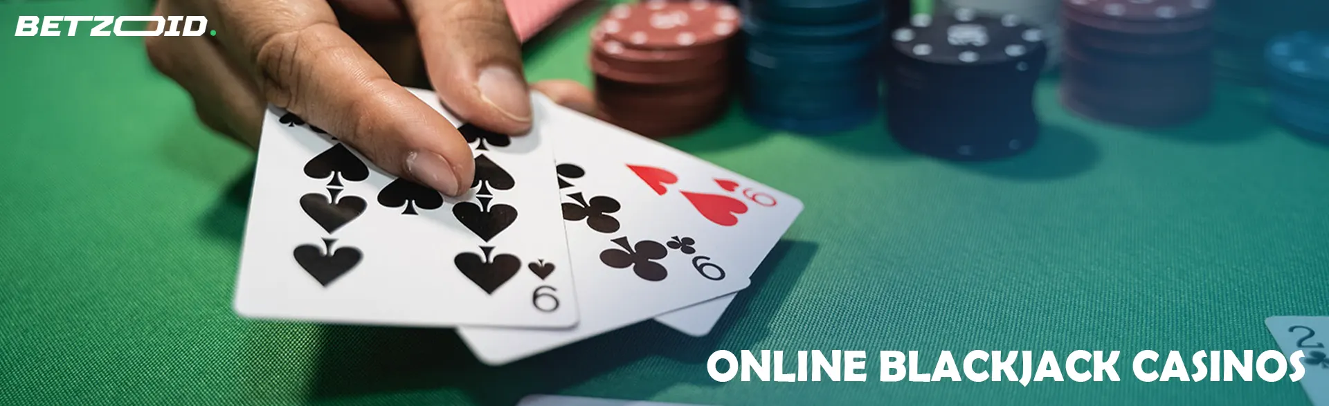 A player holds cards on the casino table.