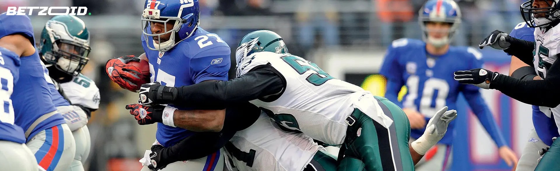 American football players fight for the ball.