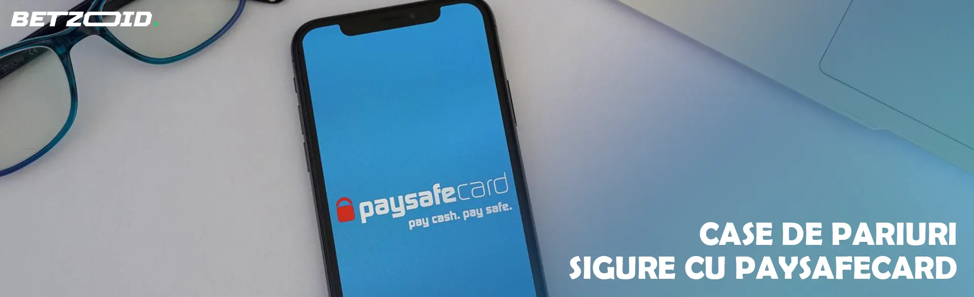 Un smartphone cu sigla Paysafecard pe ecran.