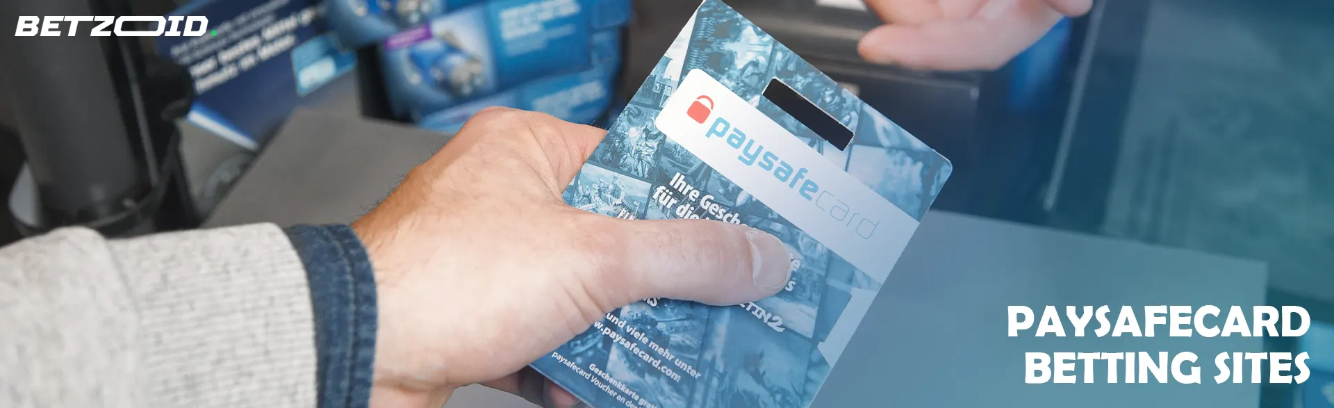 Man holding a Paysafecard.
