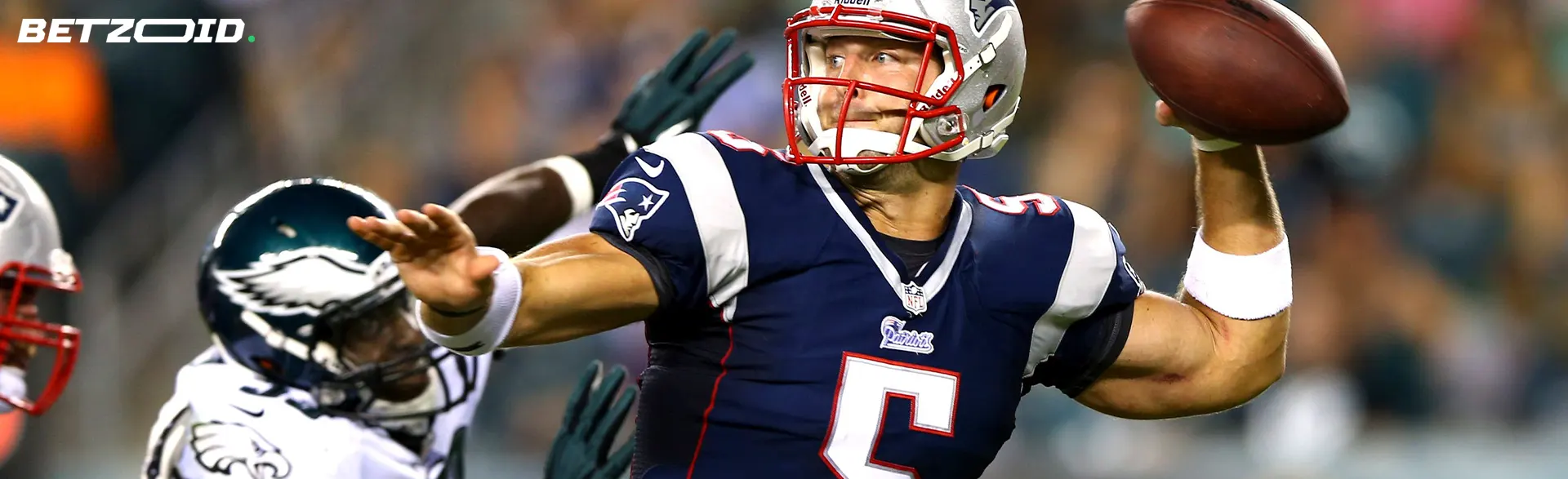American football player with the ball during the match.