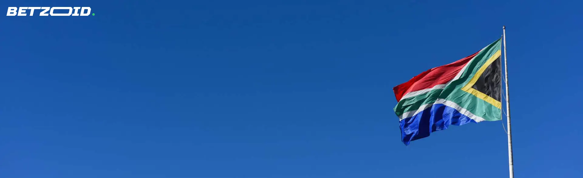 The flag of South Africa on the background of the sky.