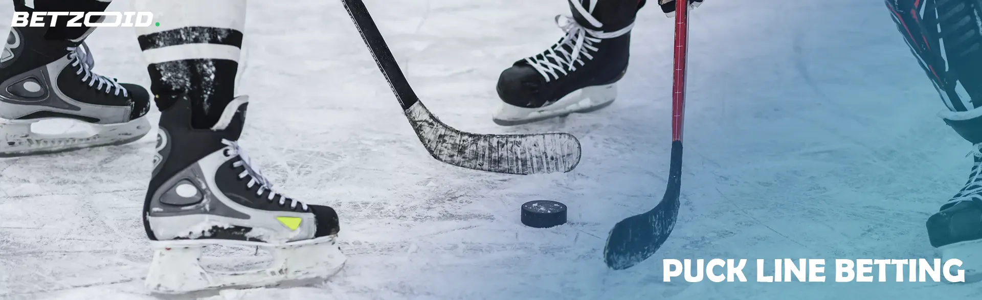 Ice hockey players with a puck.