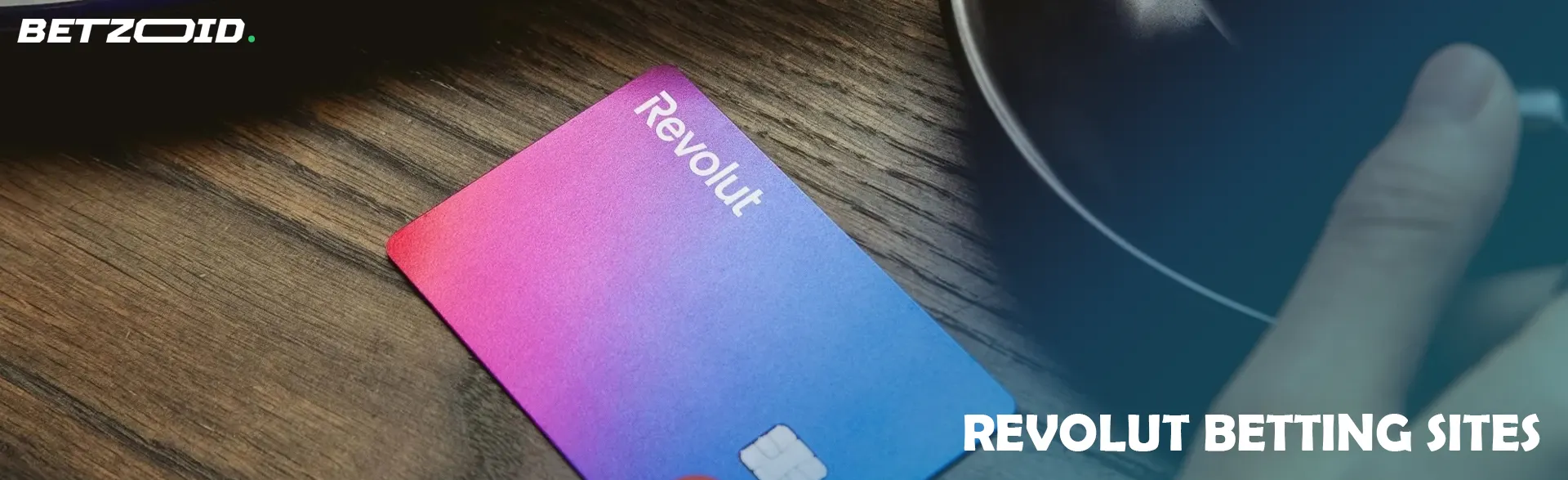 Revolut card on a wooden table.