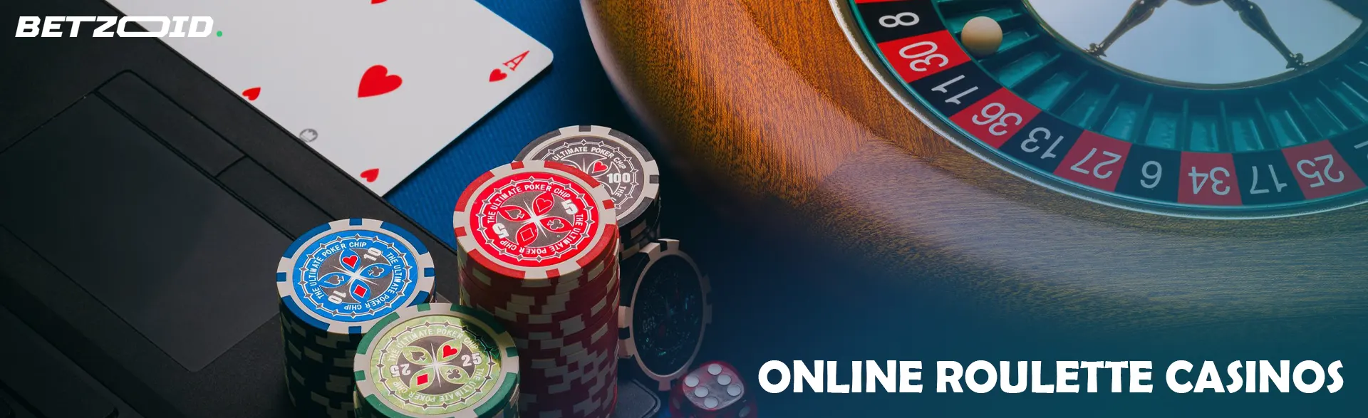 Roulette wheel and cards next to chips on keyboard.