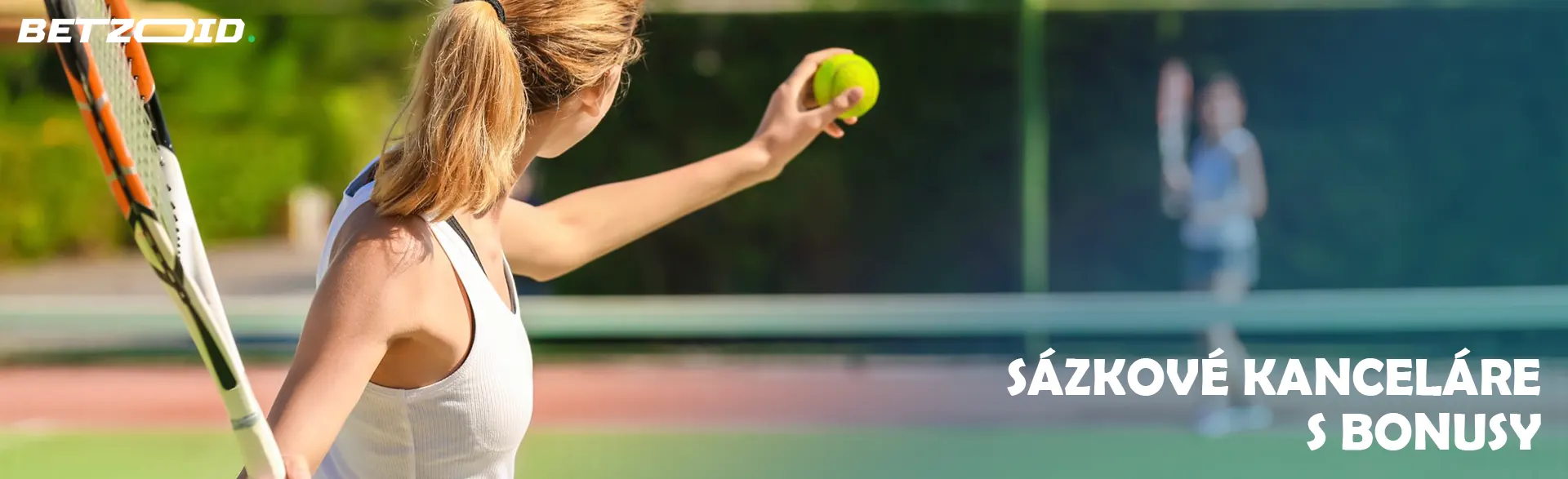 Tenistka se připravuje na podání míče.