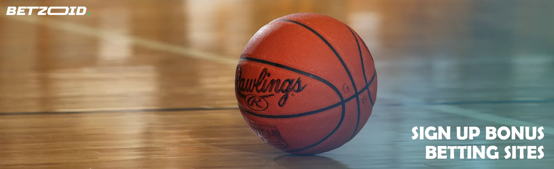The basketball is lying on the floor.