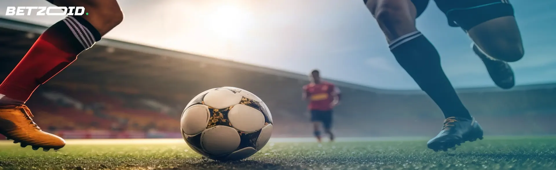 Two soccer players chasing a ball on the field, illustrating the excitement of soccer betting markets.