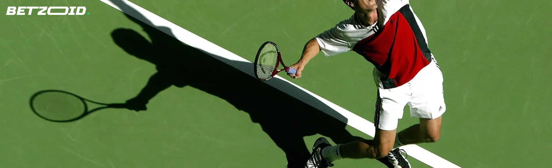 The tennis player swung to hit the ball.