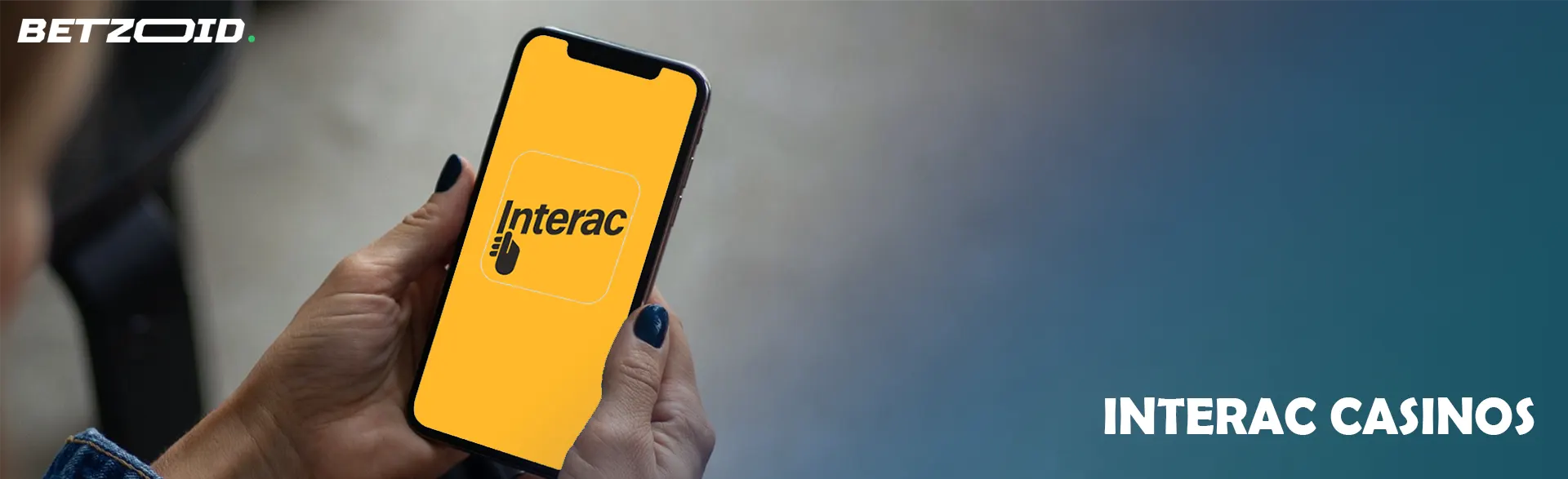 Top Interac online casinos on mobile phone screen.