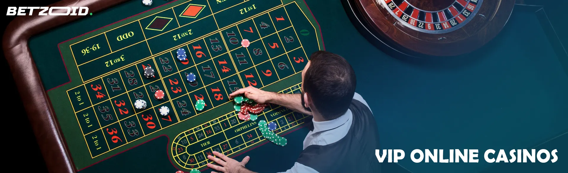 The croupier lays out the cards on the roulette table.