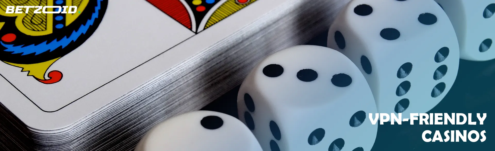 Playing dice next to a deck of cards.