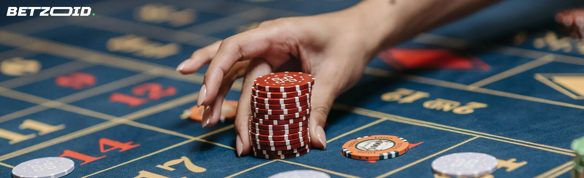 The player places chips on the casino table.